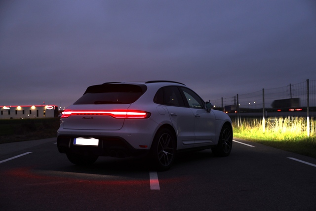 2023-2026 porsche macan s carrera white metallic taillight in the dark low angle road scene