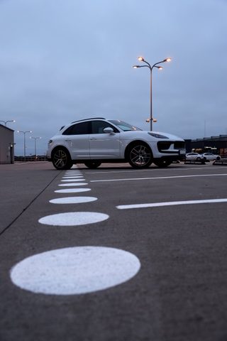 2023-2026 porsche macan s carrera white metallic vertical parking scene